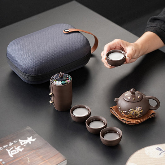 Travel tea set suit. A pot of four cups for outdoors & a portable bag.